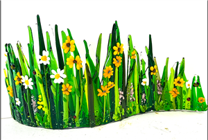 curved fused glass panel of grass with flowers