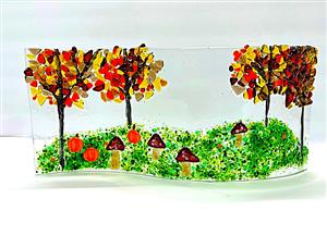 curved fused glass panel of autumn trees