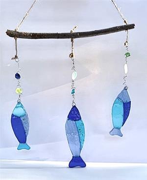 stained glass fish hanging from a stick