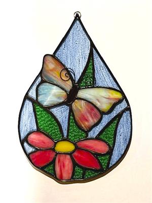 stained glass flower and butterfly in teardrop shape