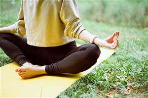 yoga pose on mat outdoors