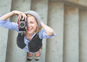 woman using vintage camera 