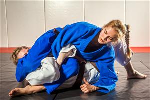 young adults in jujitsu pose