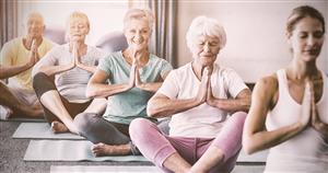 elderly yoga students on mat