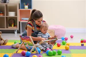 teen babysitting toddler