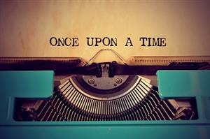 typewriter with text "once upon a time"