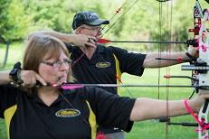 couple with archery bows