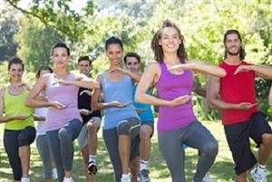 group performing tai chi outdoors