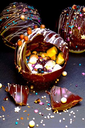 hot cocoa bombs with marshmallows and sprinkles inside