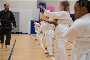 karate students posing in line