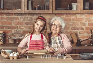 Grandma and grandaughter baking together