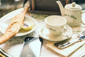 French cafe table with tea and pastry