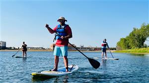 people on paddleboards