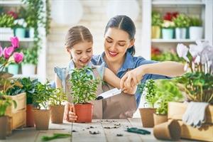 mother and daughter with gardening pots